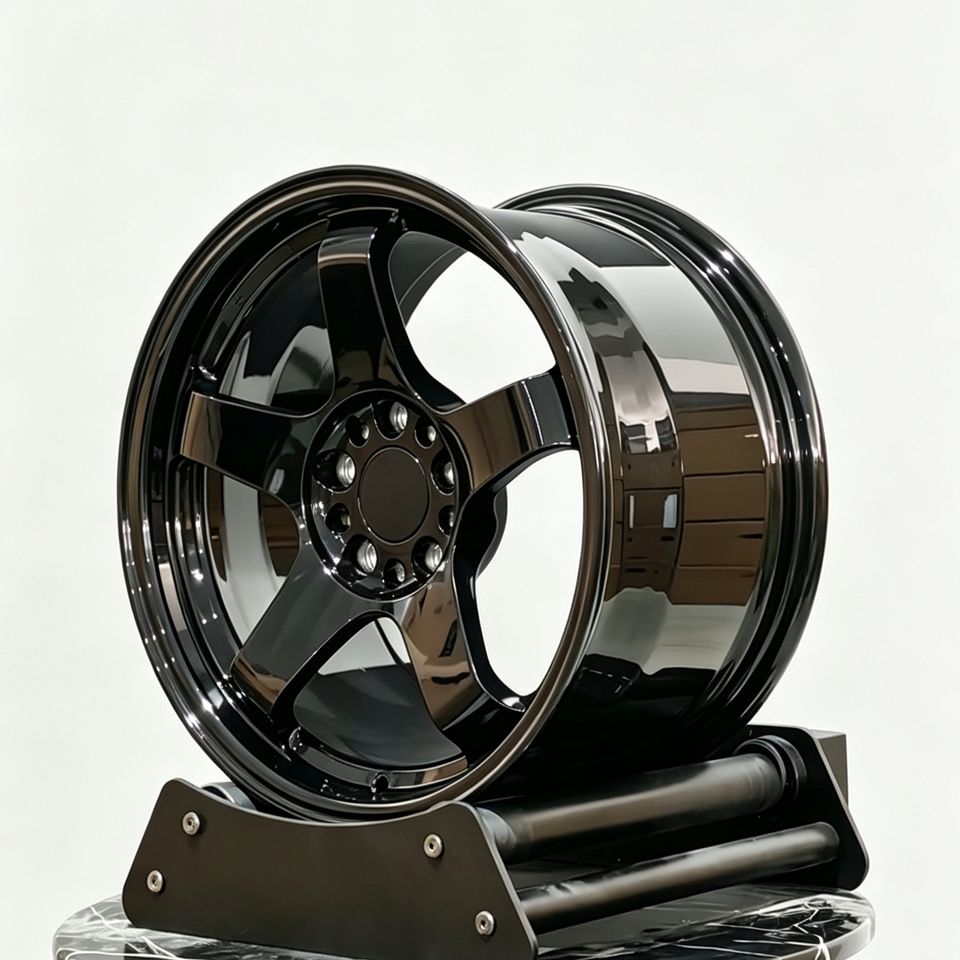 TE37-style forged wheel in gloss black, angled view
