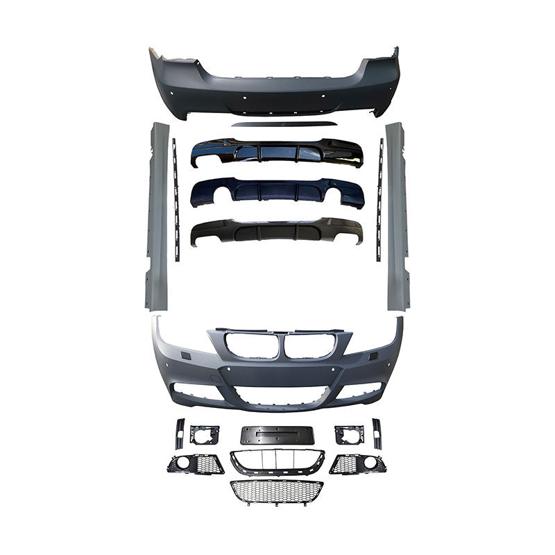 BMW E90 M-Tech full body kit — front bumper, rear bumper, side skirts, mesh grilles and trim pieces laid out