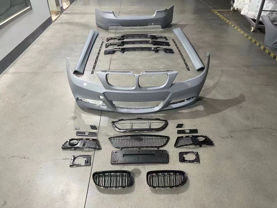 BMW E90 M-Tech kit components arranged on warehouse floor