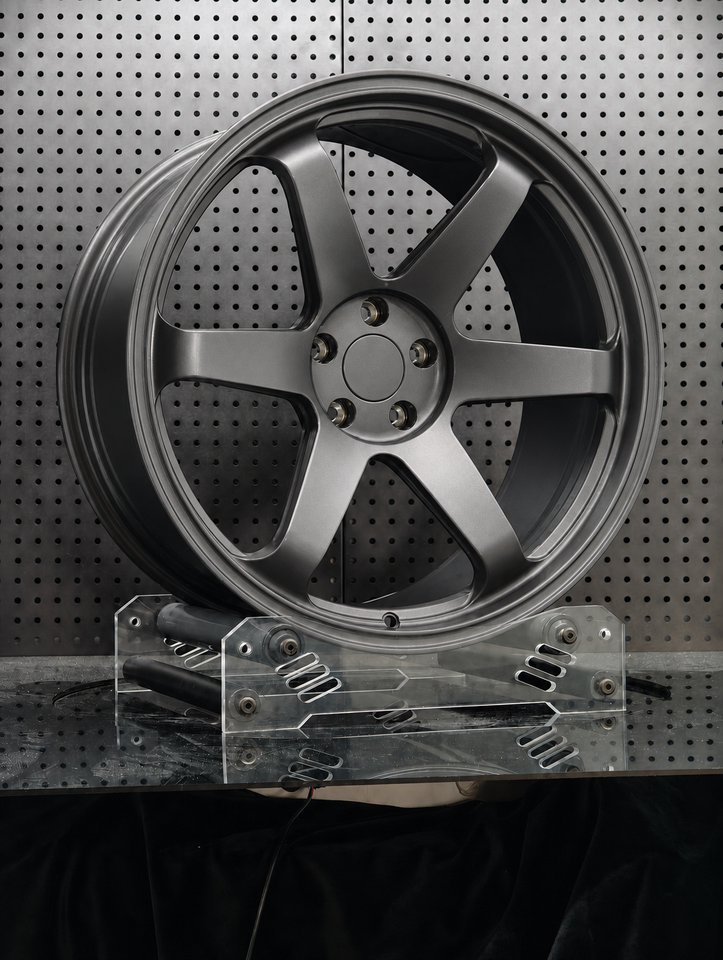 TE37-style forged wheel in anthracite grey, angled view